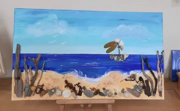 Mixed-media beach scene with ocean and driftwood.
