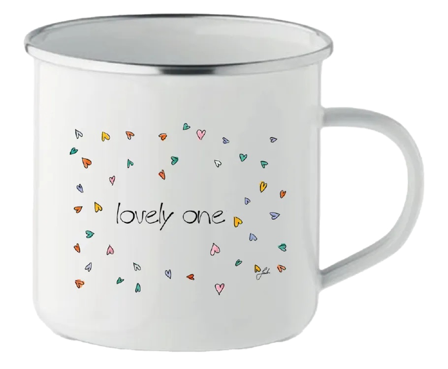 White mug with colorful heart pattern.