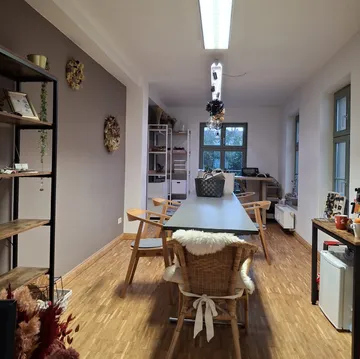 Modern dining room with table and chairs.
