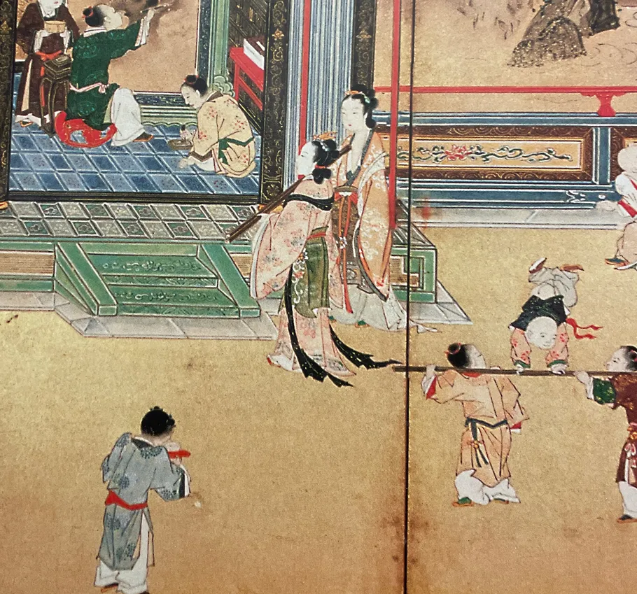Figures in traditional attire, performing inside a room.