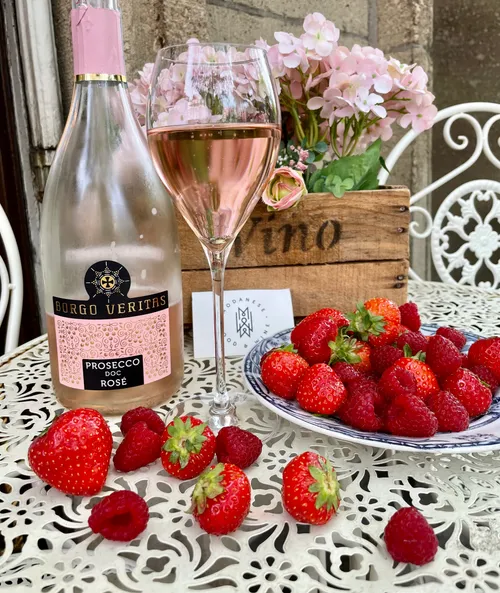 Borgo Veritas rosé with berries on table.