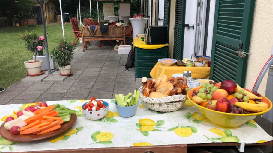 Table with snacks in garden setting.