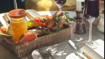 Breakfast assortment with juice on table.