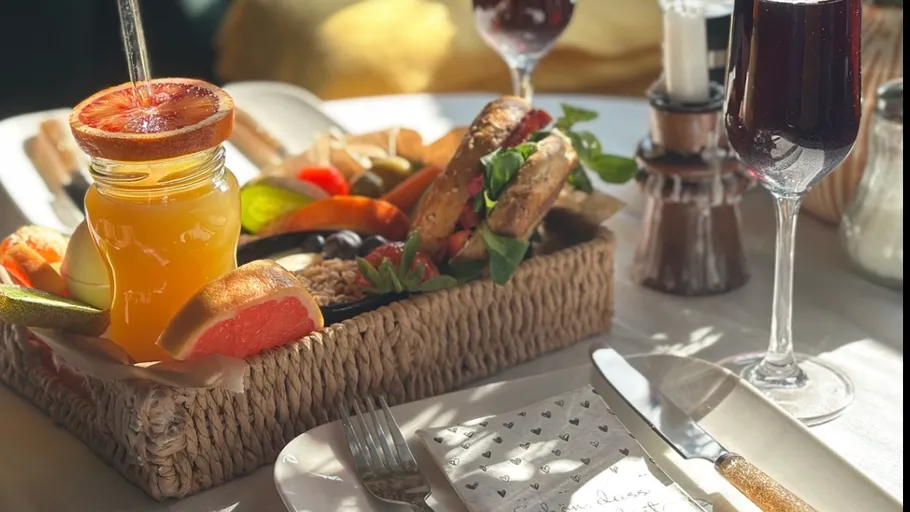 Breakfast assortment with juice on table.