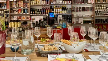 Set table with wine glasses in a store.