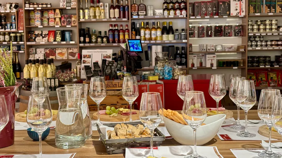 Wine and snacks on table in store.