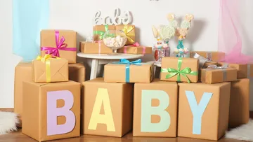 Gift boxes with 'BABY' letters and decorations.