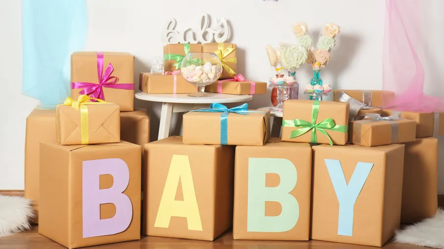 Gift boxes with 'BABY' letters and decorations.