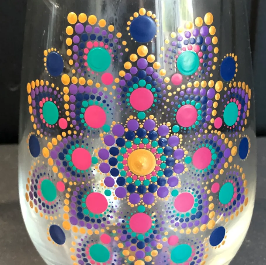Colorful dotted pattern on a glass surface.