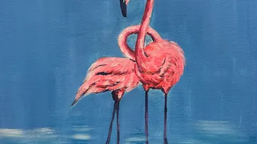 Zwei Flamingos bilden Herzform.