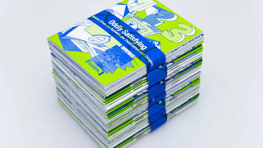 Stack of vibrant books with blue band.