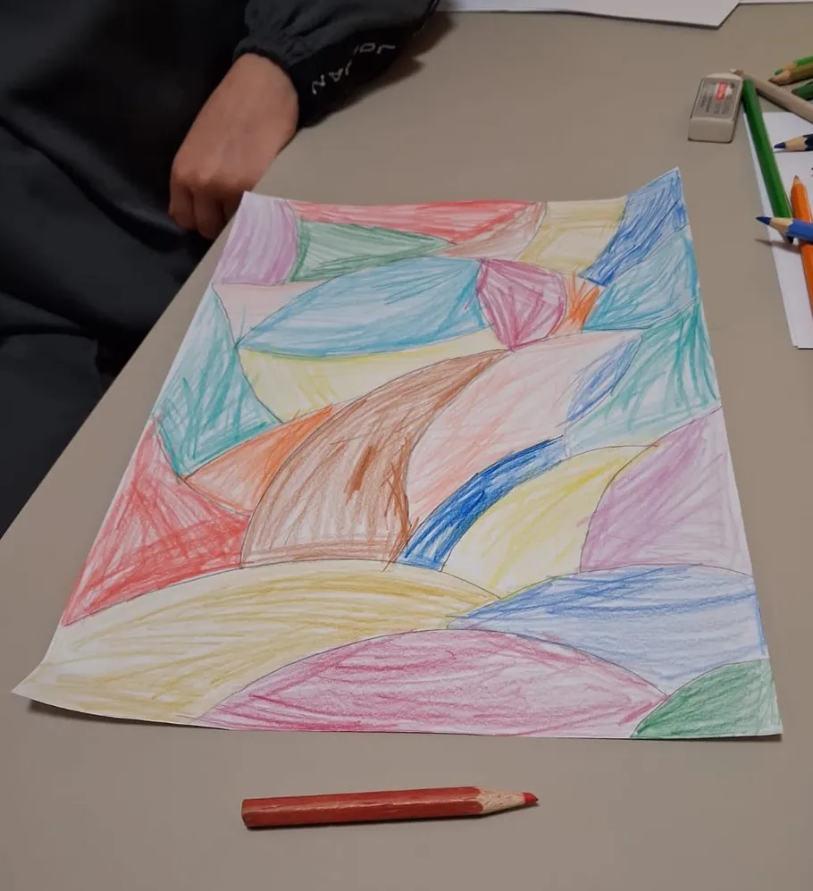Colorful abstract drawing with pencil on table.