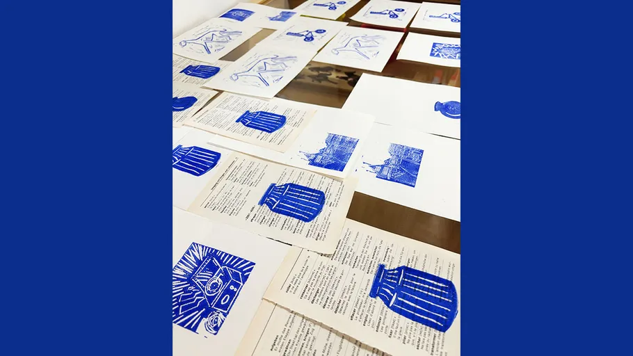 Blue prints on paper sheets on a table.
