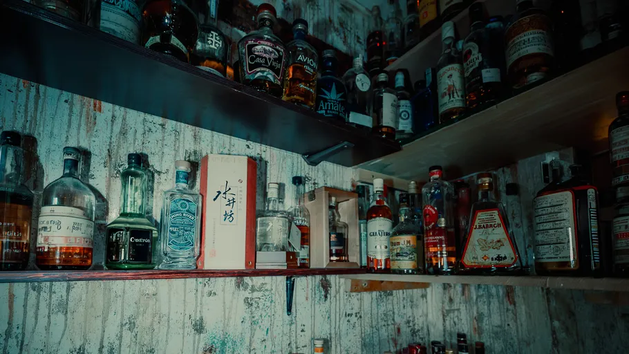 Shelves filled with various liquor bottles.