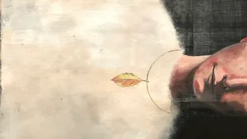 Kopf auf dem Kopf mit schwebendem Blatt daneben.