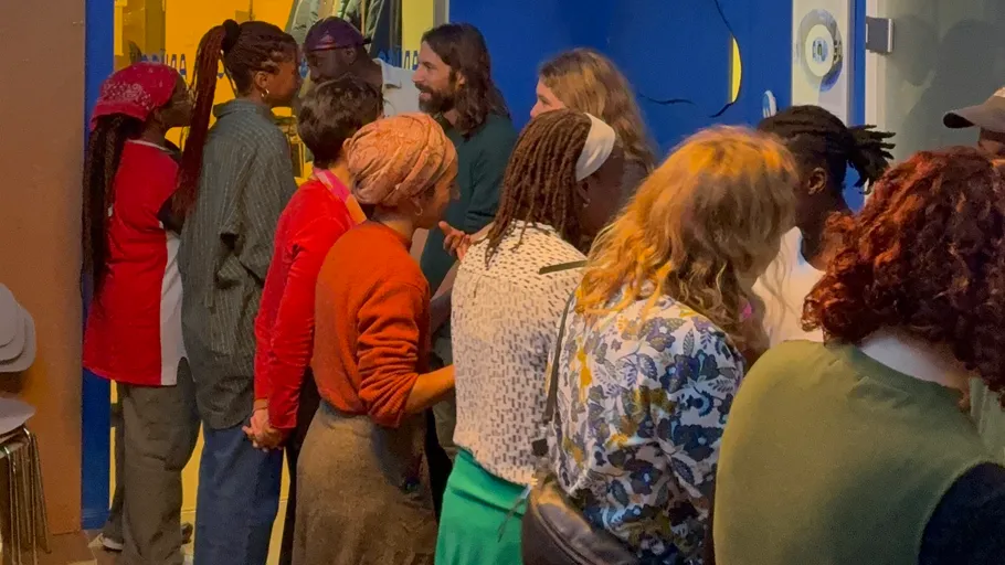 People socialize in a colorful indoor space.