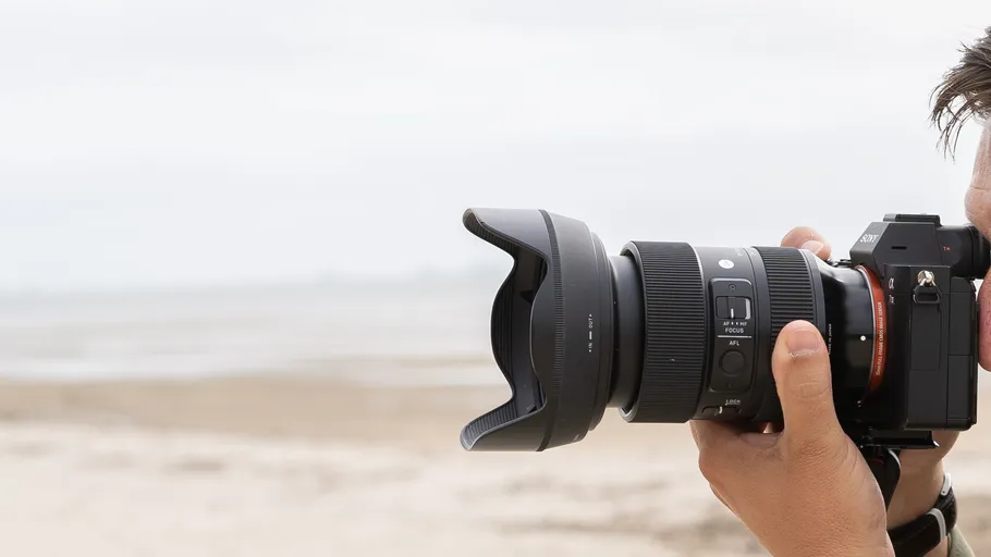 Camera with lens pointed at beach.