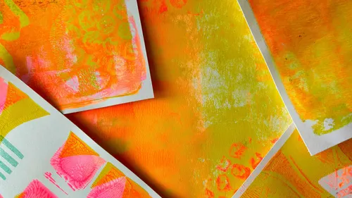Colorful abstract prints overlapping on paper.