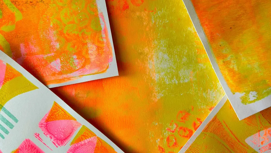 Colorful abstract prints overlapping on paper.