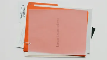 Stack of colorful folders and papers.