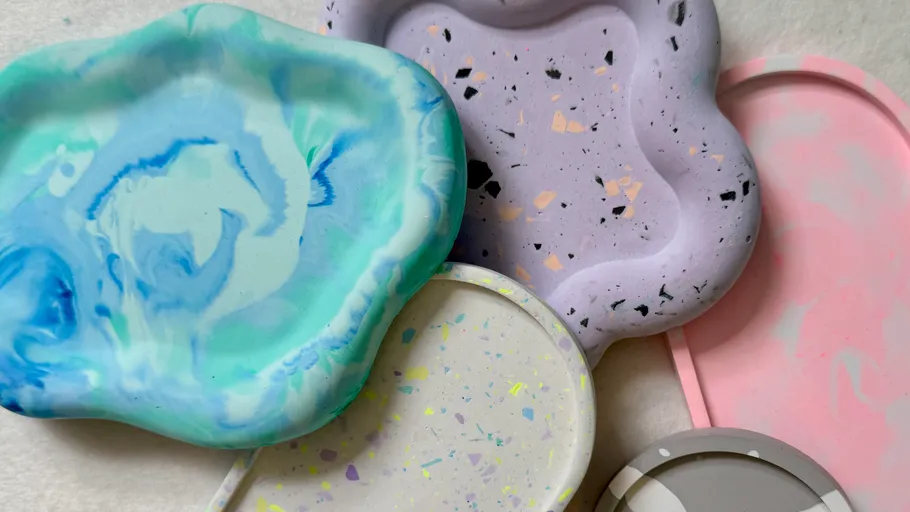 Colorful clay plates with swirling patterns, overlapping.