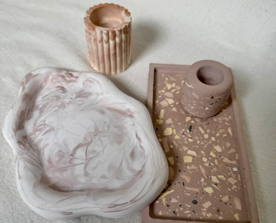 Decorative ceramic pieces on white surface.
