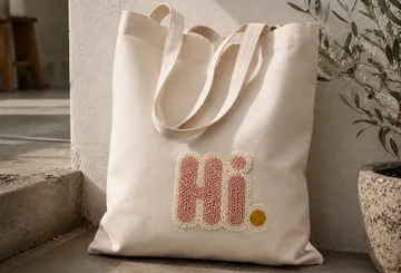 Leinwandtasche mit 'Hi.' Text, drinnen.