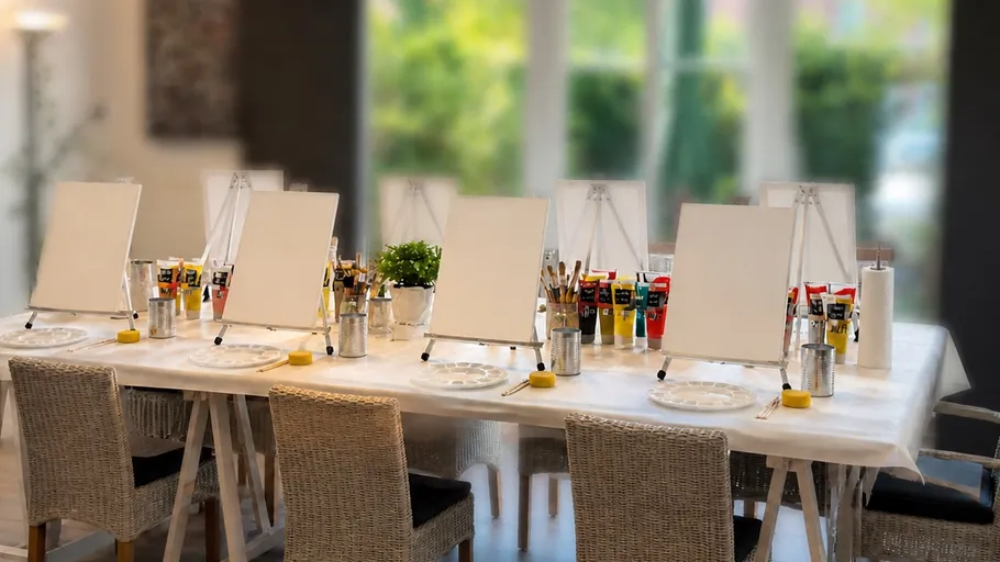 Art easel setup on a table indoors.