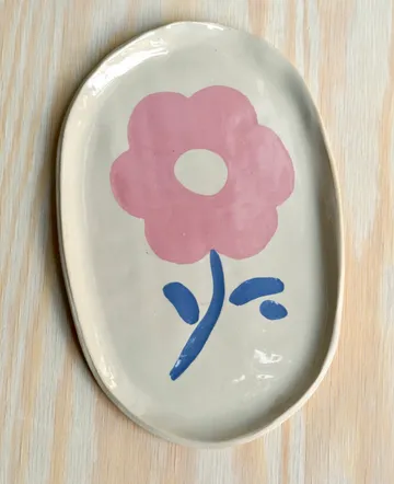 Oval plate with pink flower design.