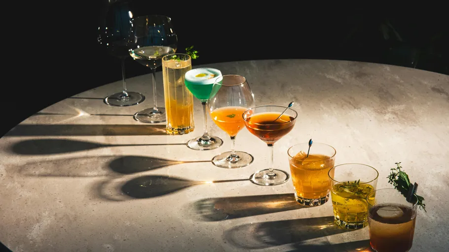 Various cocktails arranged on a round table.