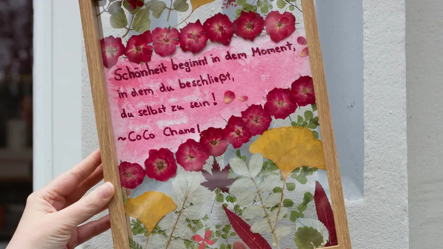Decorative frame with flowers and quote by hand.