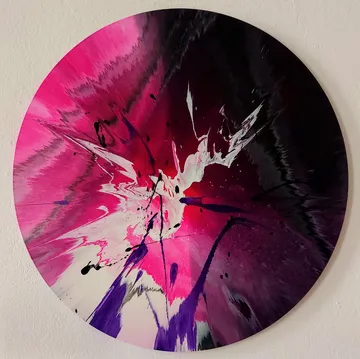 Abstract circular art with pink, black, and white.