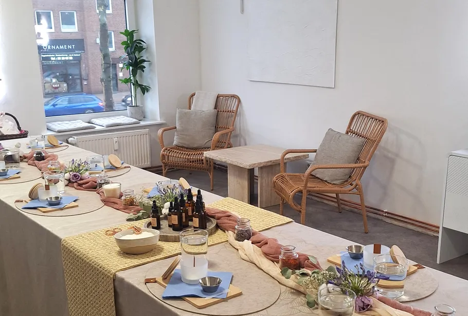 Elegant table setting with chairs in bright room.