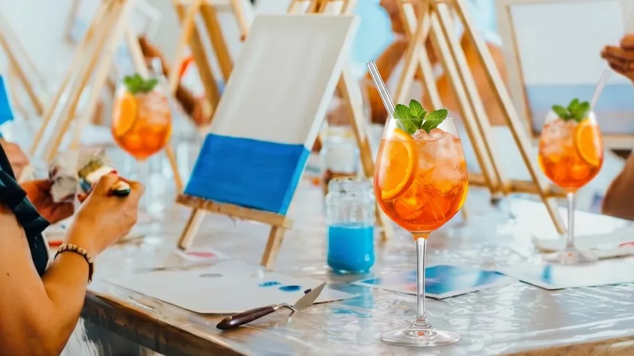 Cocktails placed on table during painting session.
