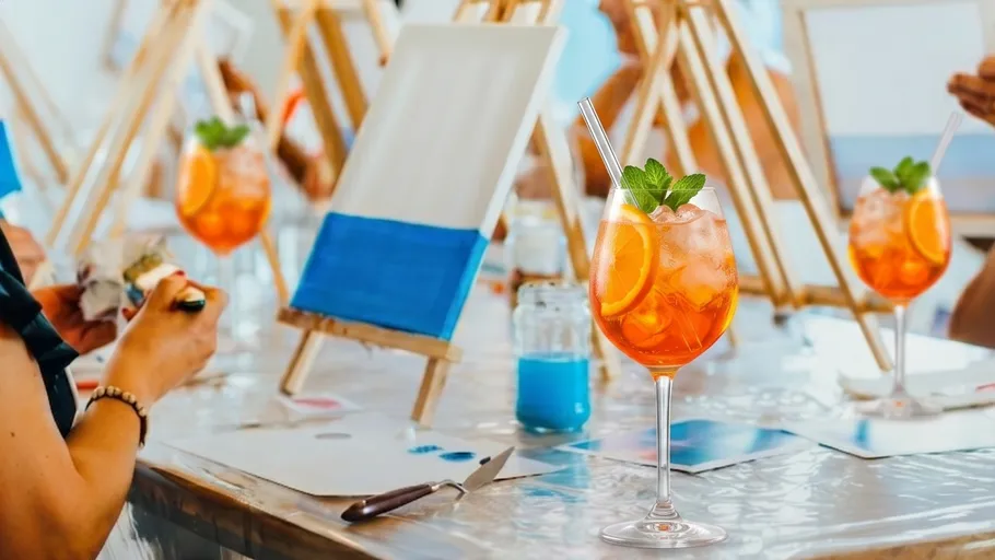 Cocktail and painting session at art class.