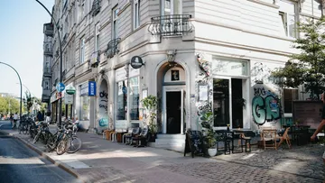 Street corner with graffiti-covered building.