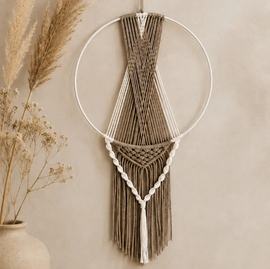 Macrame wall hanging with pampas grass decoration.