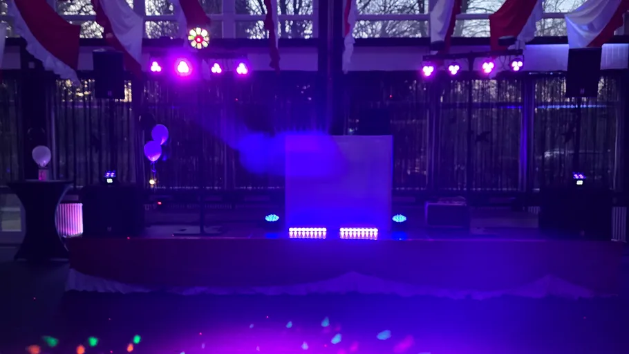 Stage with purple lighting and decorations.