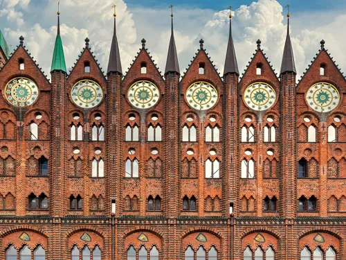 Historic building with battlements and decorated windows.