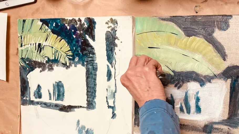Artist painting two canvases with abstract designs.