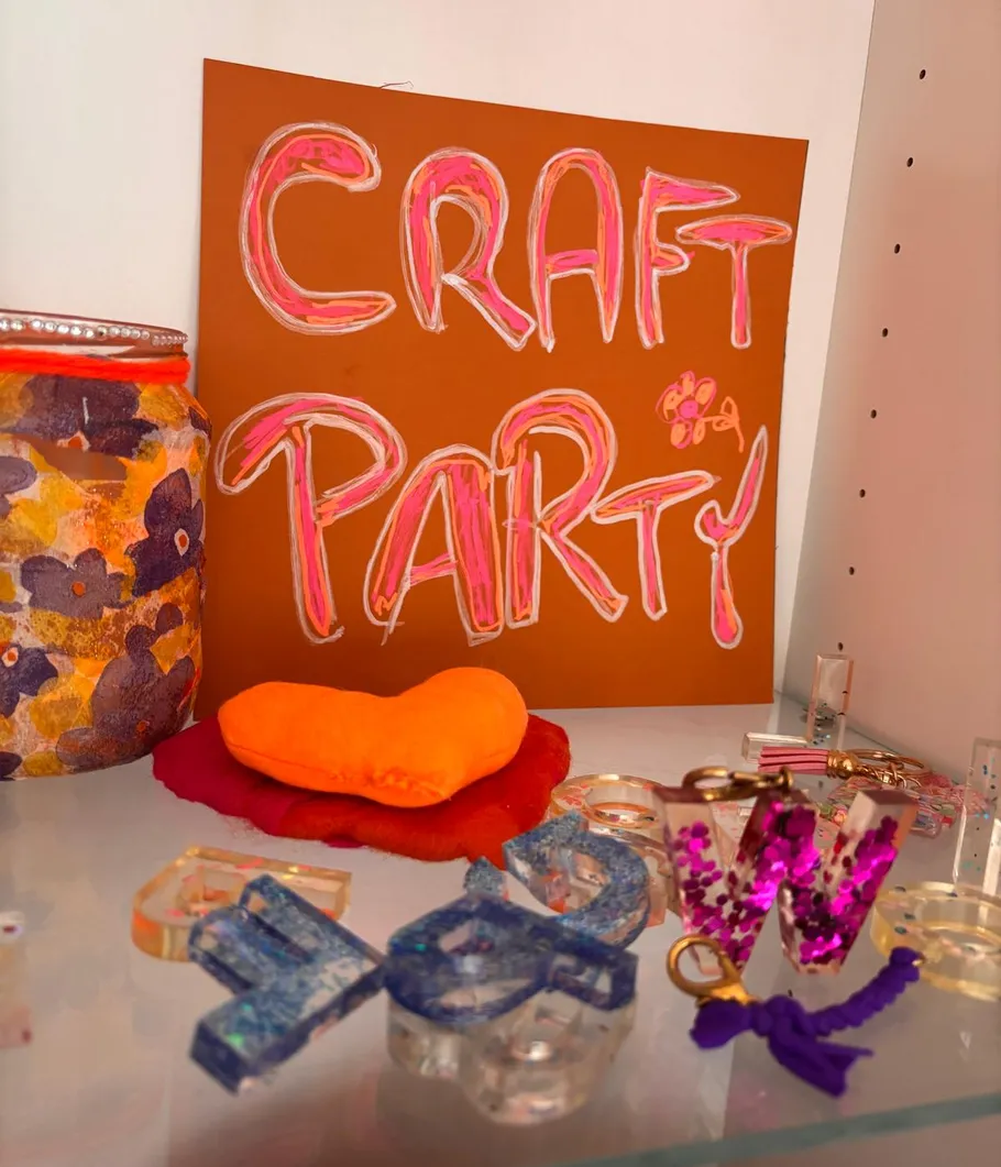 Craft items and a sign in a display.
