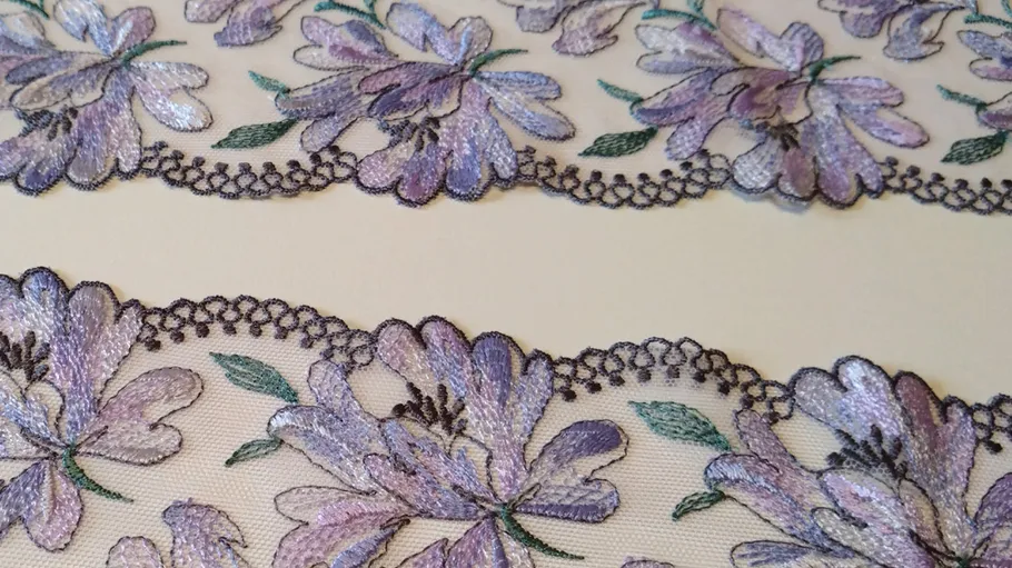 Purple floral lace pattern on beige background.