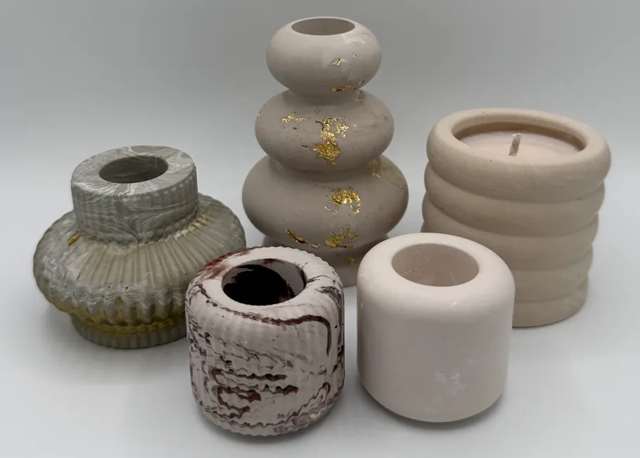 Five decorative vases with unique designs.