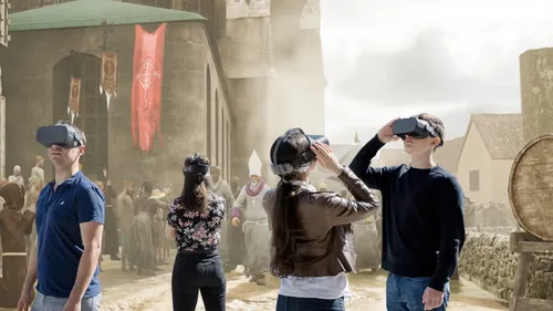 People with VR headsets in medieval setting.