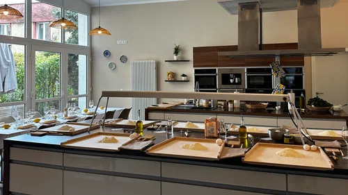Modern kitchen with prepared cooking stations.