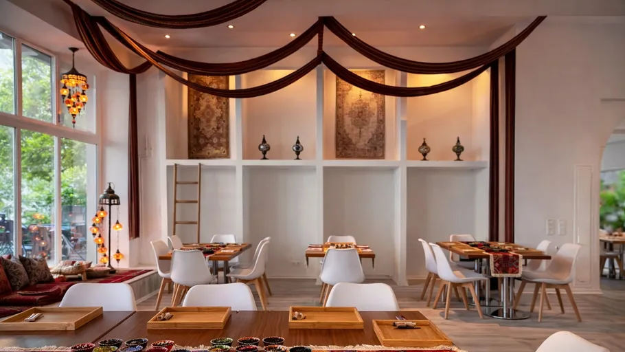 Elegant restaurant interior with decorative fabrics.