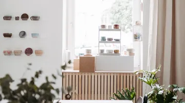 Ceramic bowls displayed in a bright room.