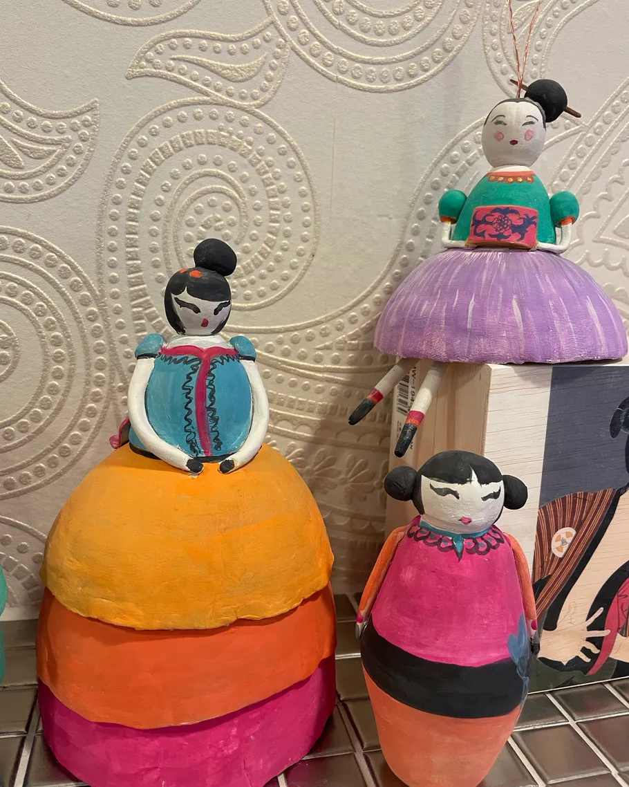 Colorful dolls with patterned background.