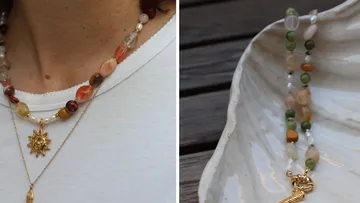 Colorful gemstone necklaces with gold pendants displayed.