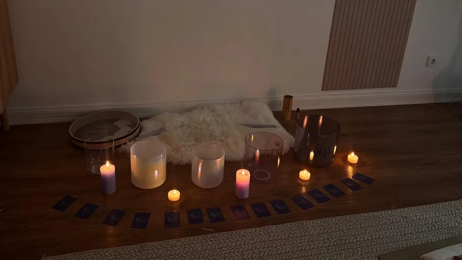 Candles and cards on a wooden floor.